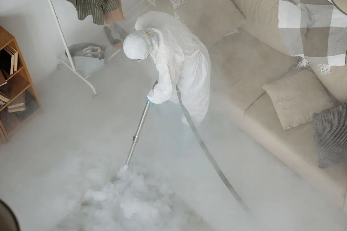 Biohazard cleanup technician in protective equipment, Roanoke, AL